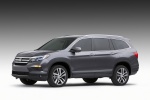 Picture of a 2016 Honda Pilot in Modern Steel Metallic from a front left three-quarter perspective