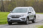 Picture of a driving 2016 Honda Pilot AWD in Lunar Silver Metallic from a front left perspective