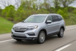 Picture of a driving 2016 Honda Pilot AWD in Lunar Silver Metallic from a front left three-quarter perspective