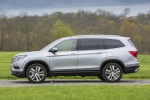 Picture of a driving 2016 Honda Pilot AWD in Lunar Silver Metallic from a side perspective