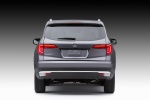Picture of a 2016 Honda Pilot in Modern Steel Metallic from a rear perspective