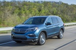 Picture of a driving 2016 Honda Pilot AWD in Steel Sapphire Metallic from a front left perspective