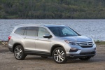 Picture of a 2017 Honda Pilot AWD in Lunar Silver Metallic from a front right perspective