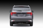 Picture of a 2017 Honda Pilot in Modern Steel Metallic from a rear perspective