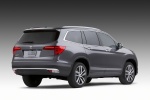 Picture of a 2017 Honda Pilot in Modern Steel Metallic from a rear right perspective