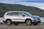 Picture of a 2018 Honda Pilot AWD in Lunar Silver Metallic from a front right three-quarter perspective