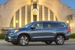 Picture of a 2018 Honda Pilot AWD in Steel Sapphire Metallic from a side perspective