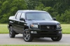 Picture of a 2013 Honda Ridgeline in Crystal Black Pearl from a front right perspective