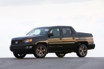 Picture of a 2013 Honda Ridgeline in Crystal Black Pearl from a front left three-quarter perspective