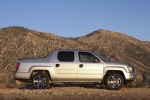 Picture of a 2013 Honda Ridgeline in Alabaster Silver Metallic from a side perspective