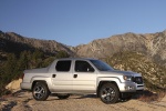 Picture of a 2013 Honda Ridgeline in Alabaster Silver Metallic from a front right three-quarter perspective