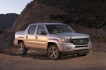 Picture of a 2013 Honda Ridgeline in Alabaster Silver Metallic from a front right perspective