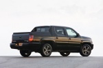 Picture of a 2013 Honda Ridgeline in Crystal Black Pearl from a rear right three-quarter perspective