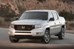 Picture of a 2013 Honda Ridgeline in Alabaster Silver Metallic from a front left perspective