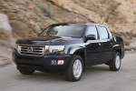 Picture of a driving 2013 Honda Ridgeline from a front left perspective