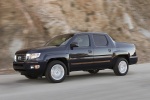 Picture of a driving 2013 Honda Ridgeline from a front left three-quarter perspective