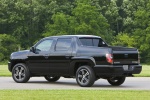 Picture of a 2013 Honda Ridgeline in Crystal Black Pearl from a rear left perspective