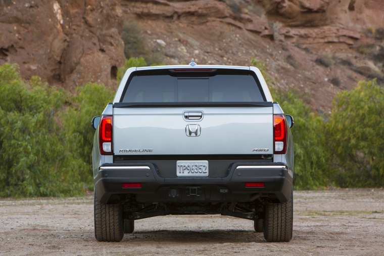 Picture of a 2017 Honda Ridgeline AWD in Lunar Silver Metallic from a rear perspective
