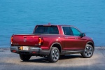 Picture of a 2017 Honda Ridgeline AWD in Deep Scarlet Pearl from a rear right perspective