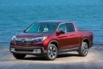 Picture of a 2017 Honda Ridgeline AWD in Deep Scarlet Pearl from a front left perspective