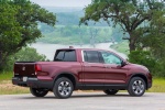 Picture of a 2017 Honda Ridgeline AWD in Deep Scarlet Pearl from a rear right three-quarter perspective