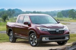 Picture of a 2017 Honda Ridgeline AWD in Deep Scarlet Pearl from a front right perspective