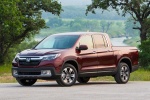 Picture of a 2017 Honda Ridgeline AWD in Deep Scarlet Pearl from a front left three-quarter perspective