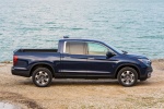 Picture of a 2017 Honda Ridgeline AWD in Obsidian Blue Pearl from a side perspective