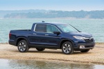 Picture of a 2017 Honda Ridgeline AWD in Obsidian Blue Pearl from a front right three-quarter perspective