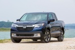 Picture of a 2017 Honda Ridgeline AWD in Obsidian Blue Pearl from a frontal perspective
