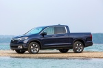 Picture of a 2017 Honda Ridgeline AWD in Obsidian Blue Pearl from a front left three-quarter perspective