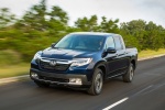 Picture of a driving 2017 Honda Ridgeline AWD in Obsidian Blue Pearl from a front left perspective