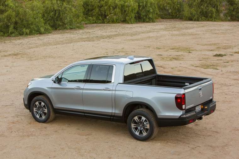 Picture of a 2018 Honda Ridgeline AWD in Lunar Silver Metallic from a rear left three-quarter perspective