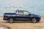 Picture of a 2018 Honda Ridgeline AWD in Obsidian Blue Pearl from a side perspective