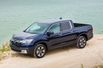 Picture of a 2018 Honda Ridgeline AWD in Obsidian Blue Pearl from a front left top perspective
