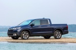 Picture of a 2018 Honda Ridgeline AWD in Obsidian Blue Pearl from a front left three-quarter perspective