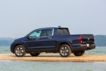 Picture of a 2018 Honda Ridgeline AWD in Obsidian Blue Pearl from a rear left three-quarter perspective