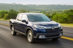 Picture of a driving 2018 Honda Ridgeline AWD in Obsidian Blue Pearl from a front right perspective