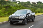 Picture of a driving 2018 Honda Ridgeline Black Edition AWD in Crystal Black Pearl from a front left perspective