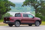 Picture of a 2019 Honda Ridgeline AWD in Deep Scarlet Pearl from a rear right three-quarter perspective