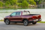 Picture of a 2019 Honda Ridgeline AWD in Deep Scarlet Pearl from a rear left three-quarter perspective