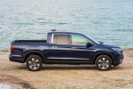 Picture of a 2019 Honda Ridgeline AWD in Obsidian Blue Pearl from a side perspective
