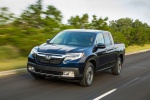 Picture of a driving 2019 Honda Ridgeline AWD in Obsidian Blue Pearl from a front left perspective