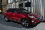 Picture of a 2014 Hyundai Santa Fe in Regal Red Pearl from a front right three-quarter perspective