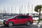 Picture of a 2014 Hyundai Santa Fe in Regal Red Pearl from a left side perspective