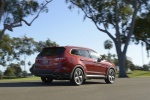 Picture of a 2015 Hyundai Santa Fe in Regal Red Pearl from a rear right perspective