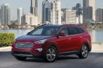 Picture of a 2015 Hyundai Santa Fe in Regal Red Pearl from a front left three-quarter perspective