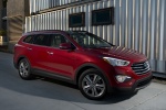 Picture of a 2016 Hyundai Santa Fe in Regal Red Pearl from a front right three-quarter perspective