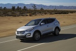 Picture of a driving 2016 Hyundai Santa Fe Sport in Sparkling Silver from a front left three-quarter perspective