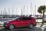 Picture of a 2016 Hyundai Santa Fe in Regal Red Pearl from a left side perspective